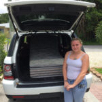 Image of person receiving a Zeno Mattress donation.